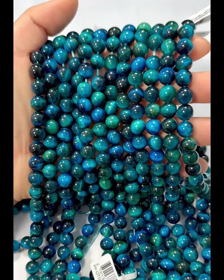 Oeil de tigre teinté Bleu A perles 8mm sur fil 40cm